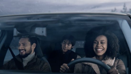 Three passengers riding in a vehicle and smiling | Mountain View Nissan of Chattanooga in Chattanooga TN